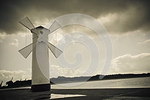 Historical windmill lighthouse in Swinoujscie, Poland photo